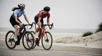 Two people on the ride together, laughing, as they decided that cycling with friends is the way to go