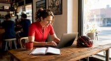 Person browsing gravel race listings on laptop