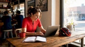Person browsing gravel race listings on laptop