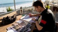 Cyclist planning cyclocross race schedule at home
