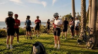 Community cycling club preparing for ride outdoors