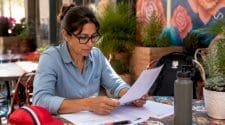 Cycling event organizer reviewing insurance papers