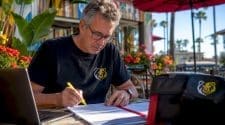 Organizer reviewing cycling event prize lists