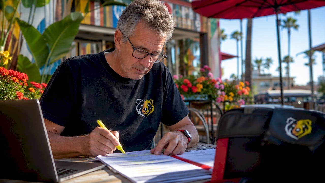 Organizer reviewing cycling event prize lists